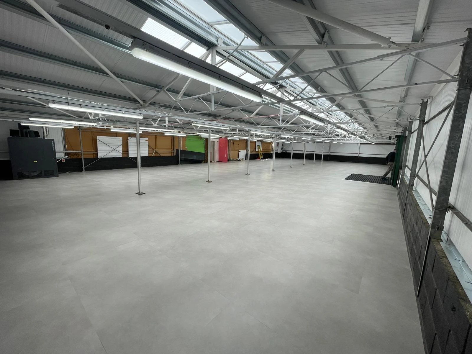 Stone effect floor tiles laid across a large commercial unit