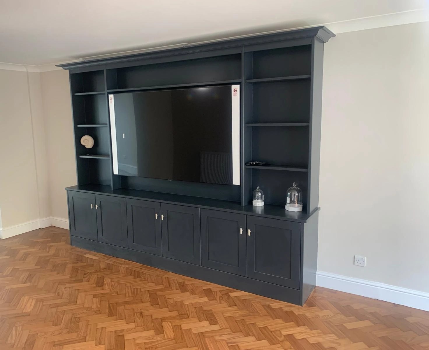 Navy painted media unit with shelving