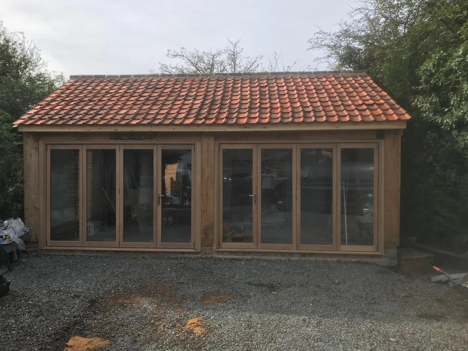 Oak framed garden building with folding doors