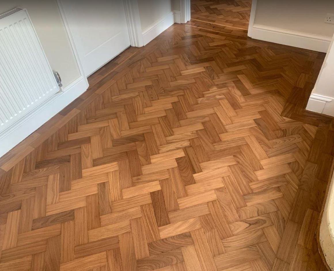 Parquet floor laid in herringbone with a border